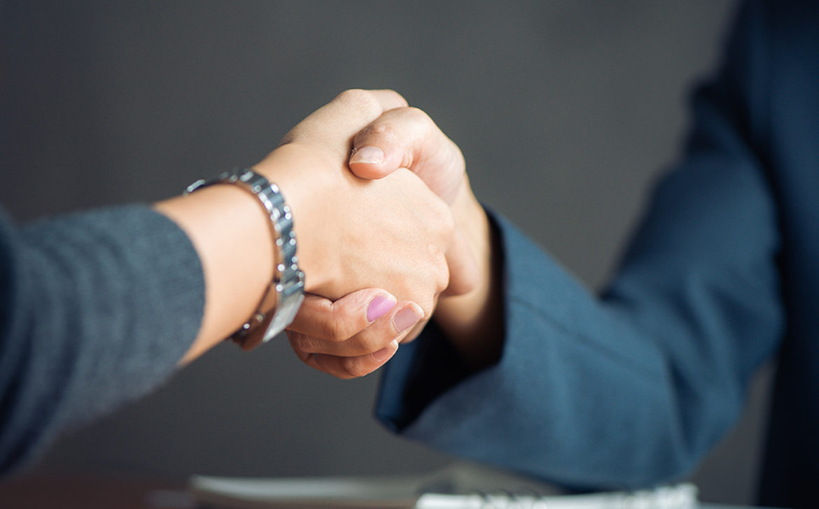 Negotiating business,Image businesswomen handshake,happy with wo